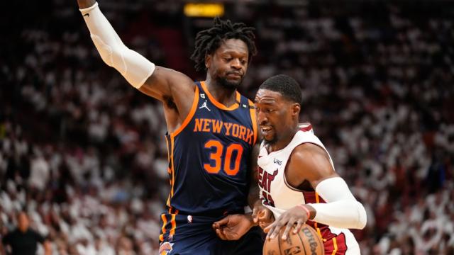 May 6, 2023; Miami, Florida, USA; Miami Heat center Bam Adebayo (13) dribbles the ball past New York Knicks forward Julius Randle (30) during the second half of game three of the 2023 NBA playoffs at Kaseya Center. Mandatory Credit: Rich Storry-USA TODAY Sports