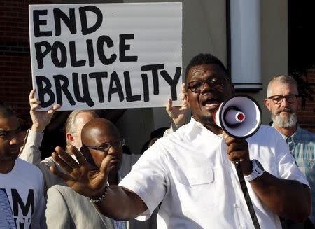 Pastor Derrick Golden speaks during a protest against what demonstrators call police brutality in McKinney, Texas June 8, 2015. REUTERS/Mike Stone