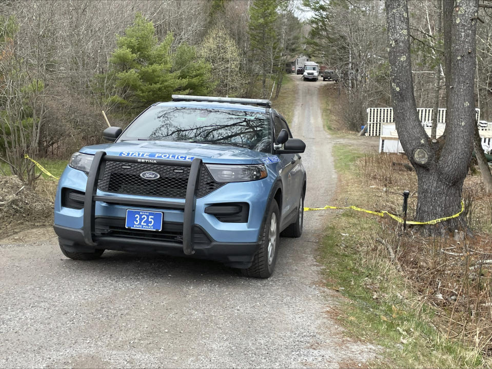 A Maine State police cruiser drives out of a crime scene in Bowdoin, Maine, Wednesday, April 19, 2023. A Maine man who police say killed four people in a home and then shot three others randomly on a busy highway had been released days earlier from prison, a state official said Wednesday. (AP Photo/Rodrique Ngowi)