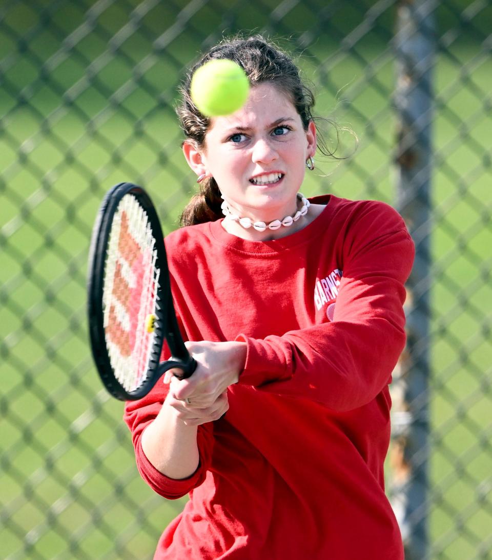 In this May 12, 2023 photo, Barnstable's number one doubles player Kate Condinho returns a Falmouth shot.
