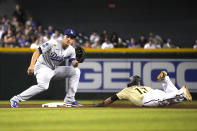 Arizona Diamondbacks' Nick Ahmed (13) steals second base under the tag by Los Angeles Dodgers shortstop Corey Seager during the fourth inning of baseball game Friday, July 30, 2021, in Phoenix. (AP Photo/Rick Scuteri)