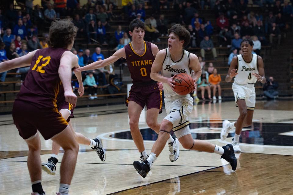 Boonville’s Clay Conner (5) drives the ball toward the Titans’ basket during the class 3A boys basketball sectional at Boonville High School on Friday night, March 3, 2023.