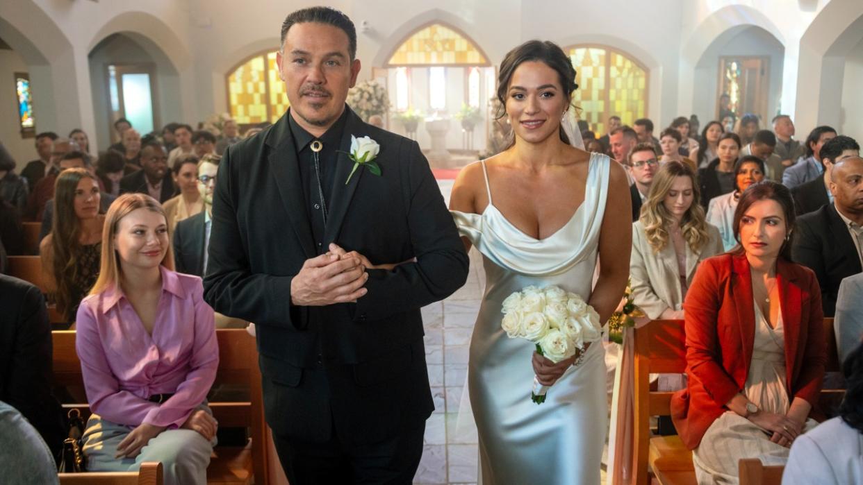  Manny walking Gabriela down the asile at her wedding in Fire Country's Season 2 finale. 