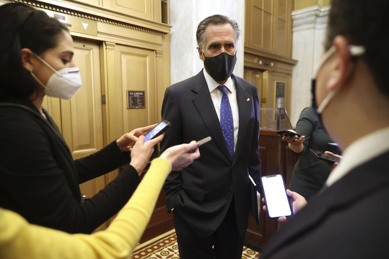 Sen. Mitt Romney, R-Utah, talks with reporters as he leaves the U.S. Capitol after the first day of Trump's second impeachment trial in the Senate, Tuesday, Feb. 9, 2021, in Washington. (Chip Somodevilla/Pool via AP)