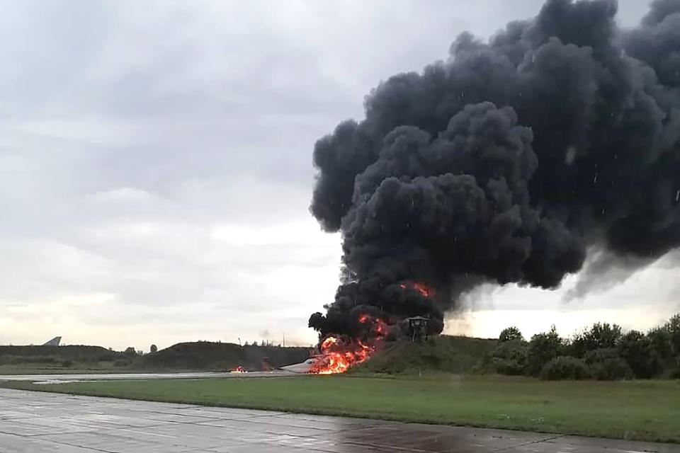 In this image released by Sirena telegram channel on Sunday, Aug. 20, 2023, a Russian warplane is burning on the Soltsy air base in the Novgorod region in northwestern Russia. Ukrainian saboteurs coordinated by Kyiv's military intelligence services carried out a pair of recent drone attacks that hit parked bomber aircraft at air bases deep inside Russia, Ukraine media claimed Tuesday. The attacks on Russian airfields on Saturday and Monday destroyed two Russian bombers and damaged two other aircraft, according to Ukrainska Pravda, as the war approaches its 18-month milestone. (Sirena telegram channel via AP)