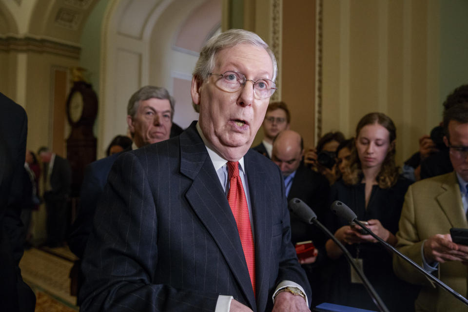 Senate Majority Leader Mitch McConnell of Ky., joined by Sen. Roy Blunt, R-Mo., rear, speaks with reporters following a closed-door strategy session, Tuesday, March 28, 2017, on Capitol Hill in Washington. (AP Photo/J. Scott Applewhite)