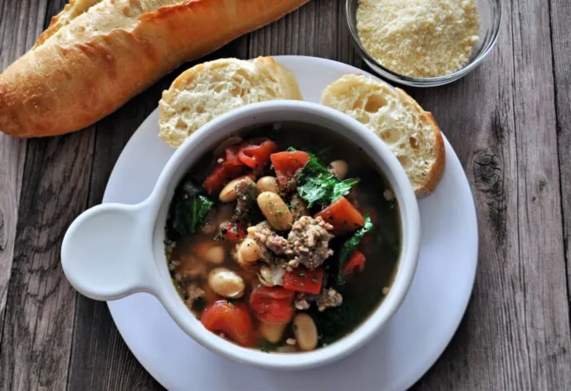 <p>Krista Marshall</p><p>A tasty Italian twist on a bean soup filled with beans, sausage, tomatoes and spinach in a rich broth, that's sure to melt any bad day away.</p><p><strong>Get the recipe: <a href="https://parade.com/1171290/kristamarshall/crock-pot-italian-sausage-and-bean-soup/" rel="nofollow noopener" target="_blank" data-ylk="slk:Crock Pot Italian Sausage and Bean Soup;elm:context_link;itc:0;sec:content-canvas" class="link rapid-noclick-resp">Crock Pot Italian Sausage and Bean Soup</a></strong></p>