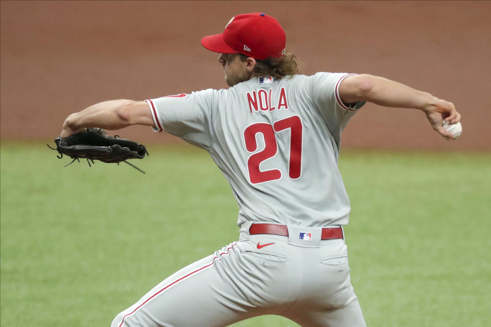 Philadelphia Phillies starting pitcher Aaron Nola throws against the Tampa Bay Rays during the first inning of a baseball game Sunday, Sept. 27, 2020, in St. Petersburg, Fla. (AP Photo/Mike Carlson)