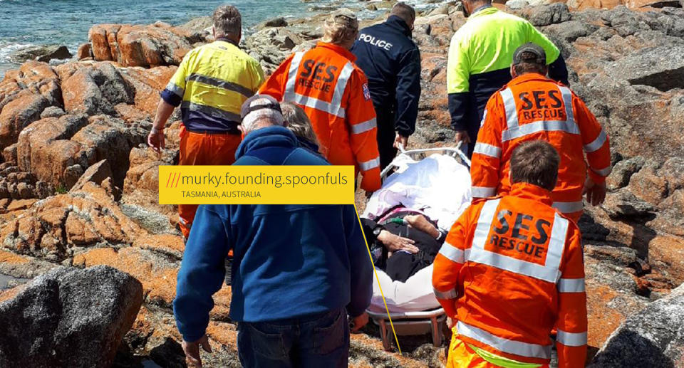 A rescue in Tasmania shows SES responders carrying a patient on a stretcher.