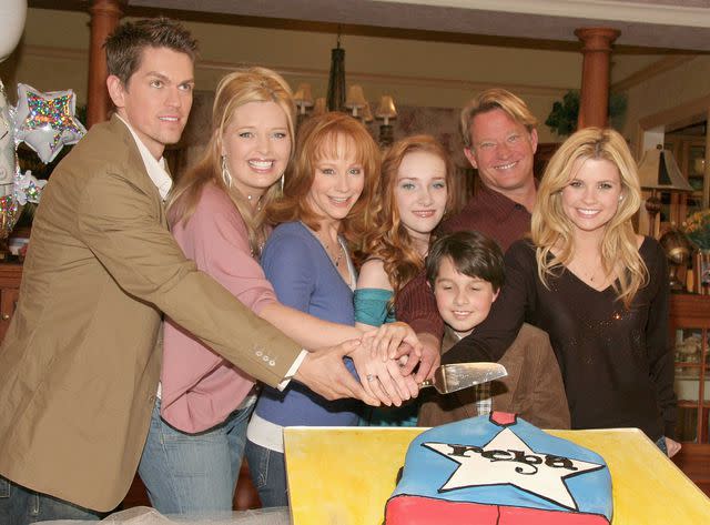 Marsaili McGrath/Getty Steve Howey, Melissa Peterman, Reba McEntire, Joanna Garcia, Mitch Holeman, Christopher Rich and Scarlett Pomers from the cast of "Reba" attend a celebration of the show's 100th episode December 12, 2005 in Culver City, California.