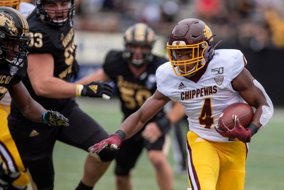 Central Michigan running back Kobe Lewis (4) rushes the ball during the Battle for the Cannon between Western Michigan and Central Michigan on Saturday, Sept. 28, 2019 at Waldo Stadium in Kalamazoo, Mich.