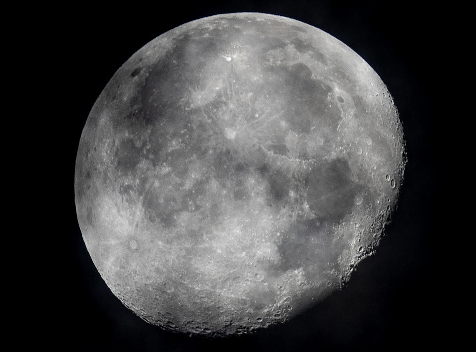 FILE - In this early Monday, Oct. 5, 2020, file photo, a waning moon is seen at the sky over Frankfurt, Germany. The moon’s shadowed, frigid nooks and crannies may hold frozen water in more places and in larger quantities than previously suspected, good news for astronauts at future lunar bases who could tap into these resources for drinking and making rocket fuel, scientists reported Monday, Oct. 26, 2020. (AP Photo/Michael Probst, File)