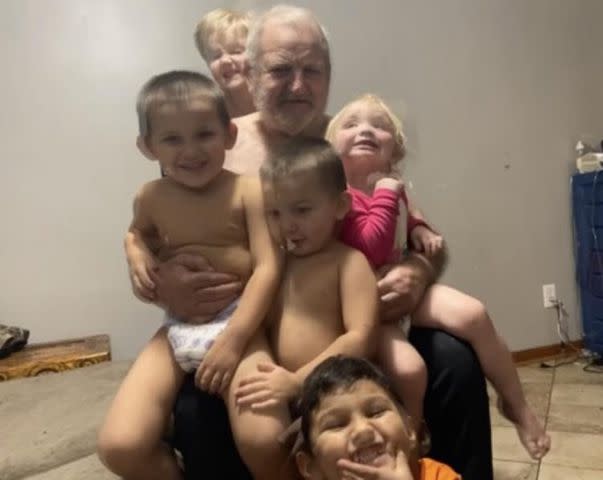 <p>Tricia Hess, family photos</p> Chloe Darnell (in the pink) with her grandfather, Lenard Slaughter, Sr., along with a brother and cousins.