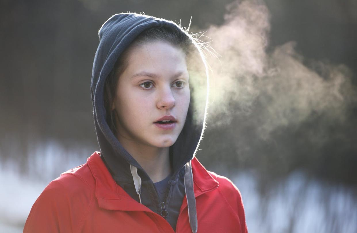 <span class="caption">Coughing, sneezing, talking and even just breathing can produce airborne particles that can spread SARS-CoV-2.</span> <span class="attribution"><a class="link " href="https://www.gettyimages.com/detail/photo/portrait-of-girl-breathing-during-morning-jogging-royalty-free-image/160438698?adppopup=true" rel="nofollow noopener" target="_blank" data-ylk="slk:Stanislaw Pytel/Digital Vision via Getty Images;elm:context_link;itc:0;sec:content-canvas"> Stanislaw Pytel/Digital Vision via Getty Images</a></span>