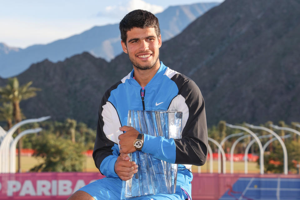 INDIAN WELLS, CA - MARCH 17: Carlos Alcaraz (ESP) poses with the trophy after winning the men's singles final of the BNP Paribas Open on March 17, 2024 at Indian Wells Tennis Garden in Indian Wells, CA. (Photo by George Walker/Icon Sportswire via Getty Images)