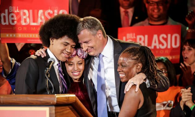 Bill de Blasio embraces his son Dante, left, daughter Chiara, second from left, and wife, Chirlane McCray, right, after polls closed in 2013. The activist left has since turned on him. (Photo: Kathy Willens/Associated Press)