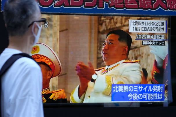PHOTO: People moves past a tv screen showing the news report about North Korea's recent missile launches near Japan Thursday, Nov. 3, 2022, in Tokyo. (Shuji Kajiyama/AP)