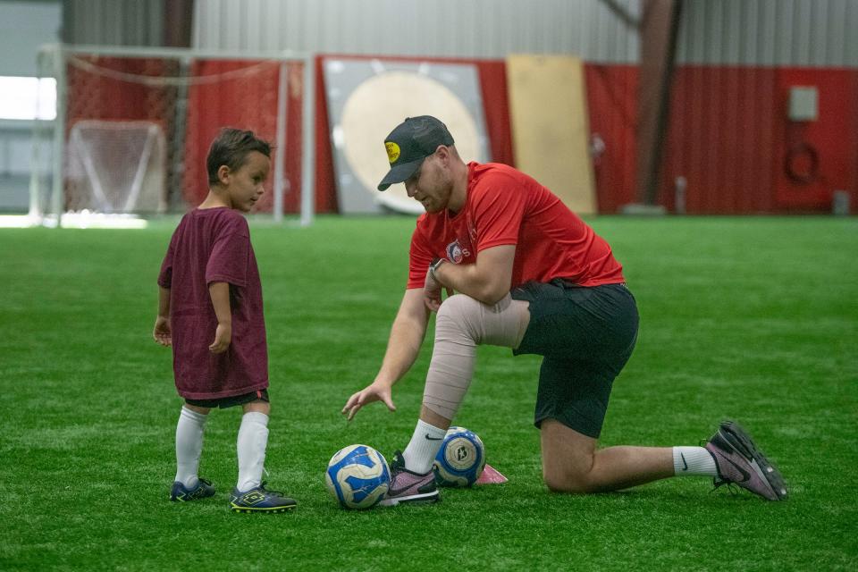 Colorado State University Pueblo's Joseph Baston mentors Trystan Thornburg, 6, as part of the Pueblo Rangers TOPSoccer program for children who have physical/developmental and cognitive/intellectual limitations on Wednesday, May 3, 2023, in Pueblo, Colo.