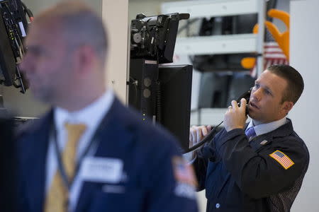 Traders work on the floor of the New York Stock Exchange August 25, 2015. REUTERS/Brendan McDermid