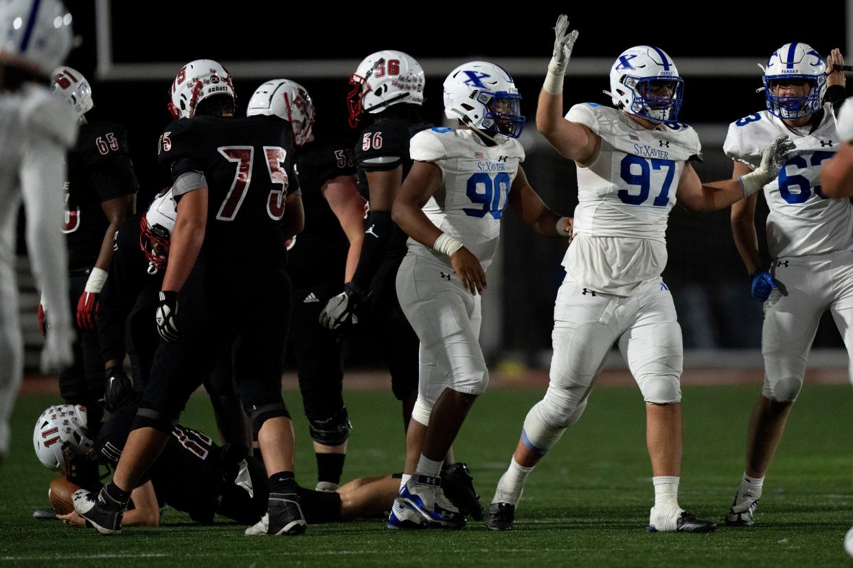 St. Xavier defensive lineman Ted Hammond (97) celebrates after sacking La Salle quarterback Patrick McLaughlin (11) in the fourth quarter of the OHSAA football game between La Salle and St. Xavier at La Salle High School in Monfort Heights on Friday, Oct. 7, 2022.