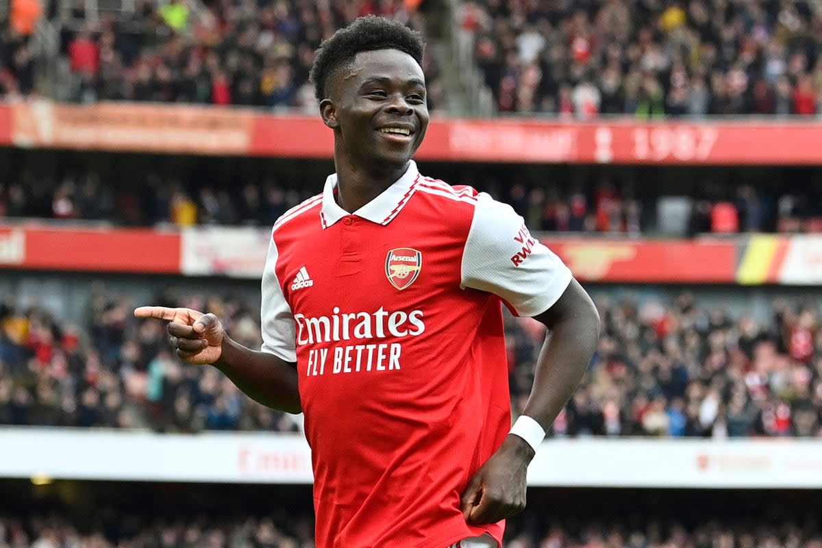Bukayo Saka is being tipped to beat Erling Haaland to Premier League Player of the Year  (AFP via Getty Images)