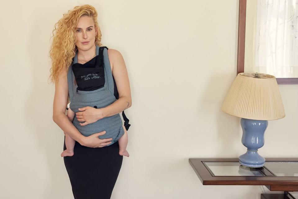 <p>Courtesy of BUMPSUIT</p> Rumer Willis and daughter Louetta in Bumpsuit Armadillo carrier