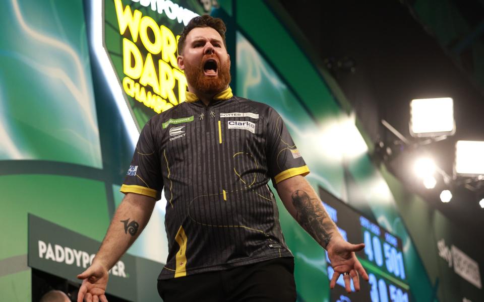 Scott Williams celebrates after being Martin Schindler at the World Darts Championship