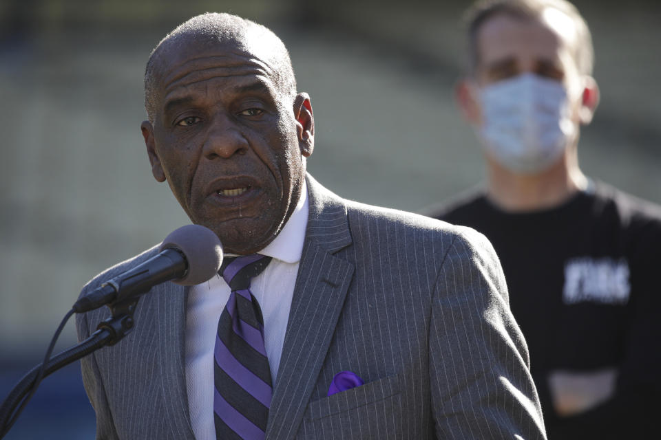 FILE - In this Jan. 15, 2021, file photo, state Sen. Steven Bradford, D-Gardena, addresses a press conference at Dodger Stadium in Los Angeles. A landmark California committee to study reparations for African Americans is meeting for its first time Tuesday, June 1, 2021, launching a two-year process to address the harms of slavery and systemic racism. "We have lost more than we have ever taken from this country, we have given more than has ever been given to us," said Sen. Bradford, who is on the committee. (Irfan Khan/Los Angeles Times via AP, Pool, File)