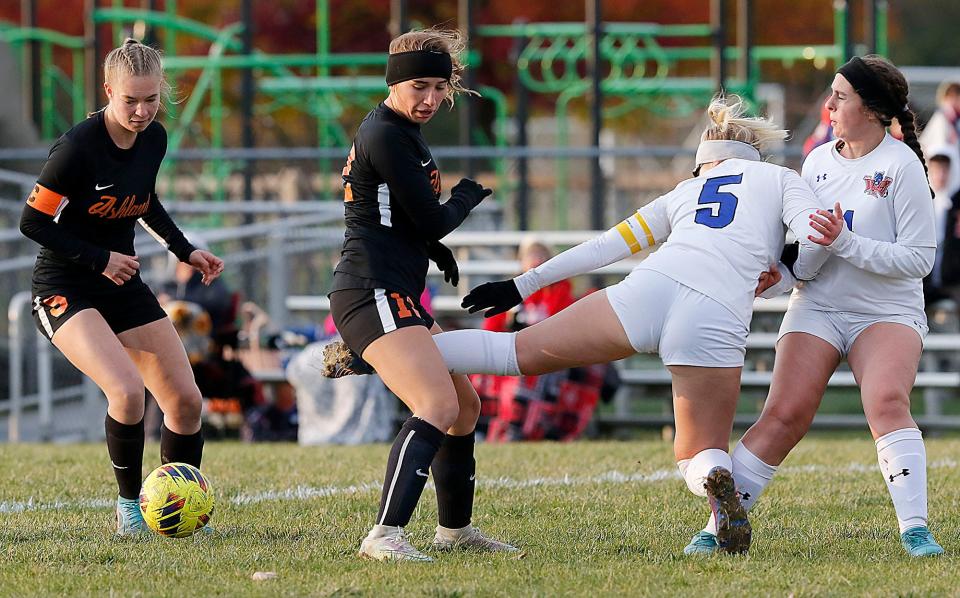 Ashland High School's Karissa Beverly (3) and Adi Helbert (12) go after the ball against Springfield High School's Elise Dodson (5) and Leah Winslow during high school girls soccer action at Ashland Community Soccer Stadium Wednesday, Oct. 19, 2022. TOM E. PUSKAR/ASHLAND TIMES-GAZETTE