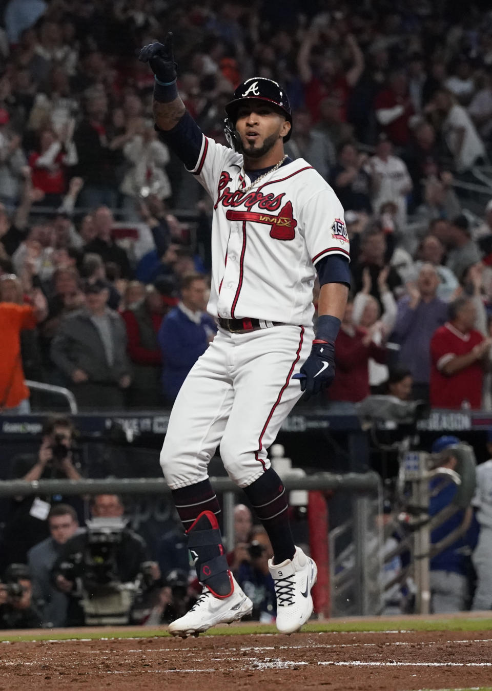 Atlanta Braves' Eddie Rosario celebrates after hitting a three run home run during the fourth inning in Game 6 of baseball's National League Championship Series against the Los Angeles Dodgers Saturday, Oct. 23, 2021, in Atlanta. (AP Photo/Ashley Landis)