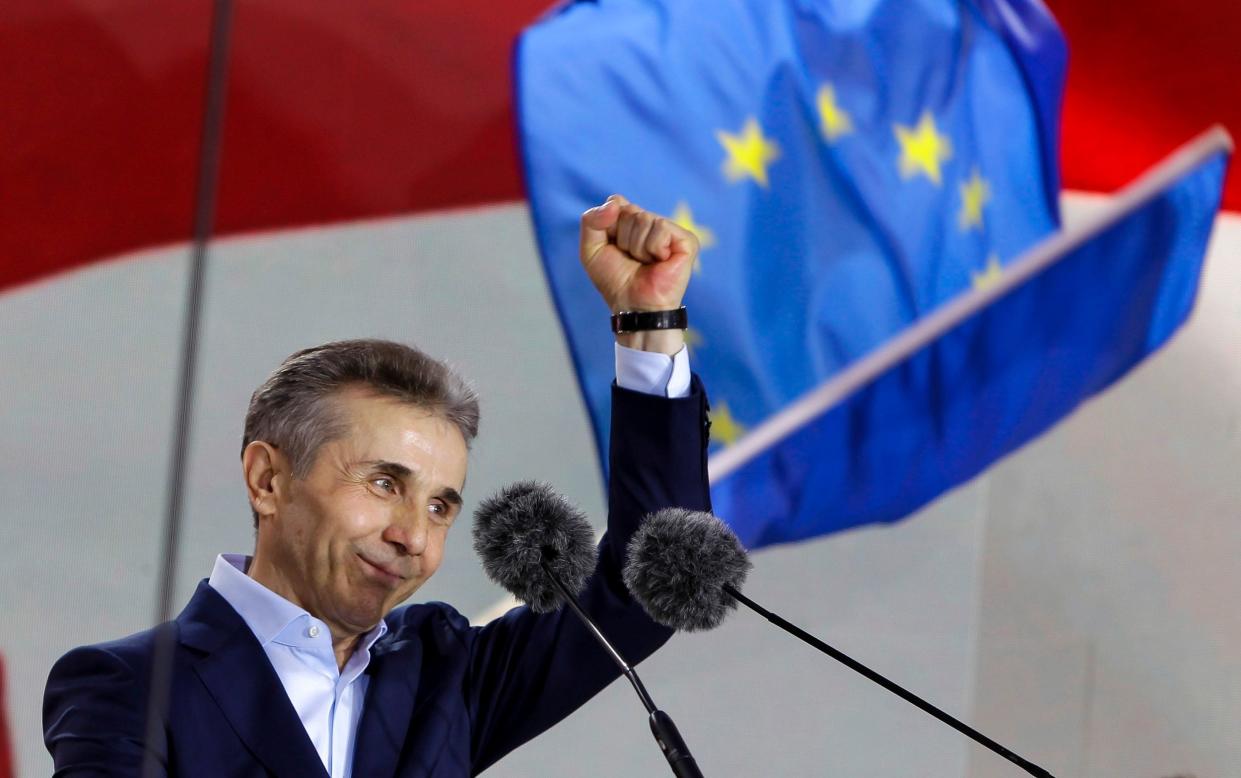 Bidzina Ivanishvili greets demonstrators during a rally in support of 'Russian law' in Tbilisi