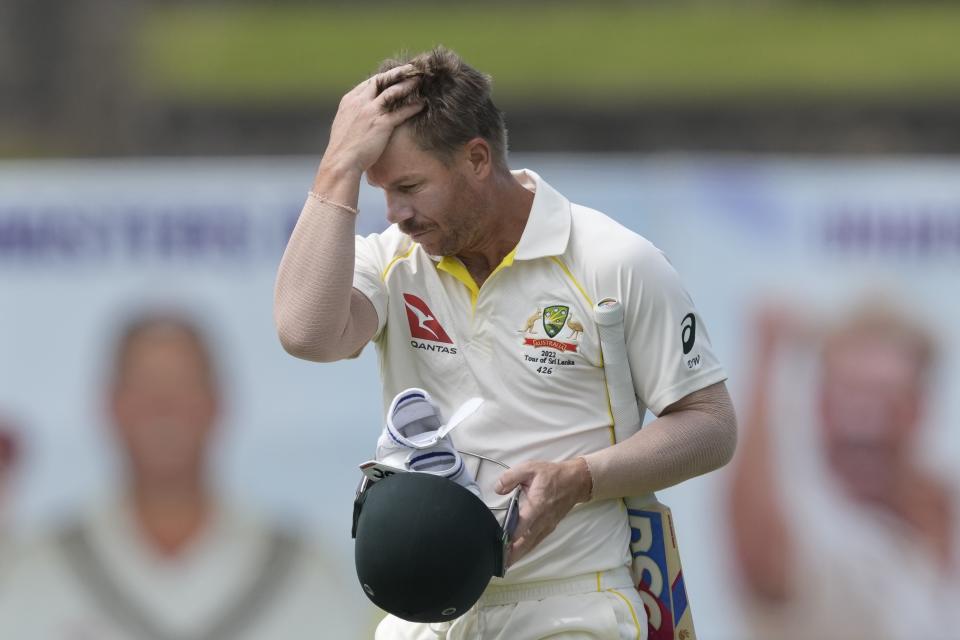 Australia's David Warner leaves the field after being dismissed by Sri Lanka's Kasun Rajitha during the first day of the second cricket test match between Australia and Sri Lanka in Galle, Sri Lanka, Friday, July 8, 2022. (AP Photo/Eranga Jayawardena)