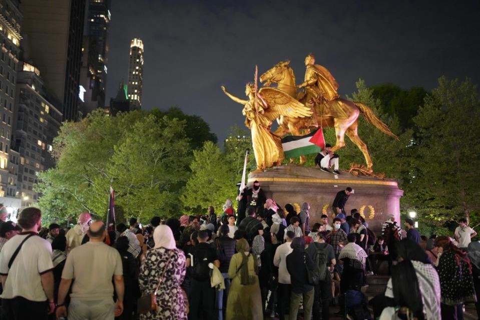 A Palestinian flag was placed on the statue Monday night. James Keivom