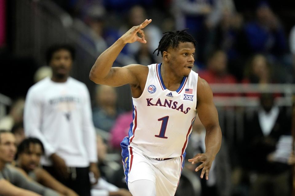 Kansas guard Joseph Yesufu celebrates after making a shot during the first half of a Big 12 Conference tournament game Thursday against West Virginia in Kansas City.