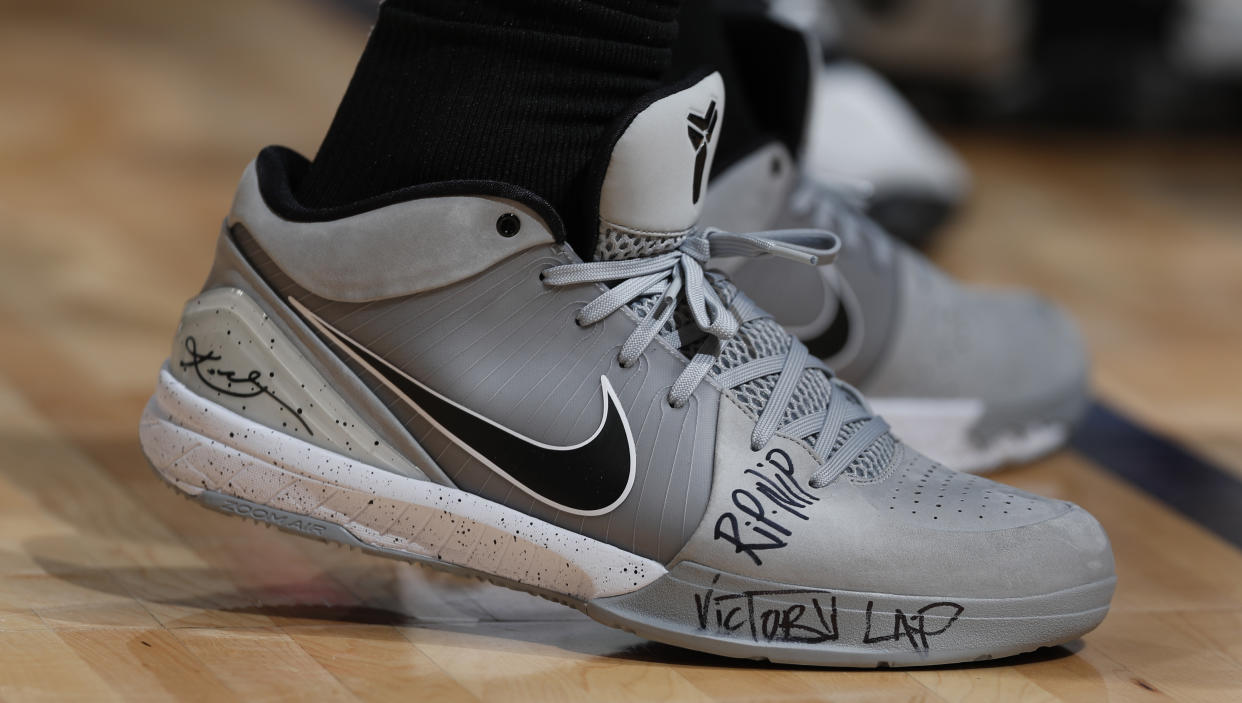 San Antonio Spurs guard DeMar DeRozan (10) wears Nike Kobe Bryant shoes bearing a tribute to slain rapper Nipsey Hussle in the second half of an NBA basketball game Wednesday, April 3, 2019, in Denver. The Nuggets won 113-85. (AP Photo/David Zalubowski)