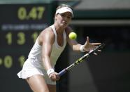 Eugenie Bouchard of Canada hits a return during her women's singles quarter-final tennis match against Angelique Kerber of Germany at the Wimbledon Tennis Championships, in London July 2, 2014. REUTERS/Max Rossi (BRITAIN - Tags: SPORT TENNIS)