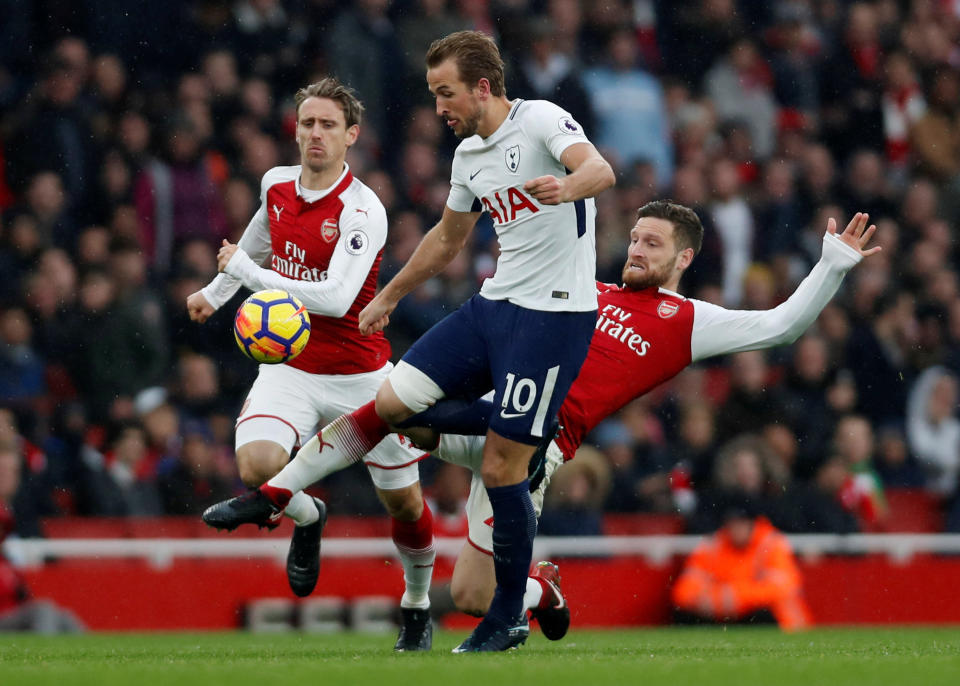 <p>Tottenham’s Harry Kane takes on Arsenal’s Shkodran Mustafi</p>