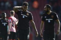 <p>Hull City’s Tom Huddlestone and Ahmed Elmohamady at full time </p>