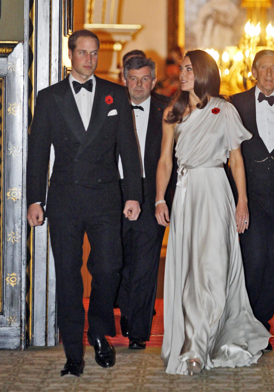 <p>At a charity dinner, Kate was seen in a one-shouldered silver Jenny Packham gown with Jimmy Choo platform sandals. </p><p><i>[Photo: PA]</i></p>