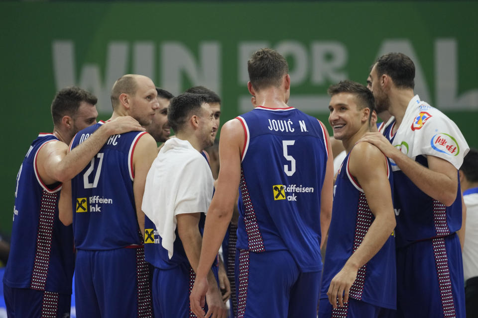 Serbia team celebrate after winning against Dominican Republic during their Basketball World Cup second round match at the Araneta Coliseum, Manila, Philippines on Sunday Sept. 3, 2023. (AP Photo/Aaron Favila)