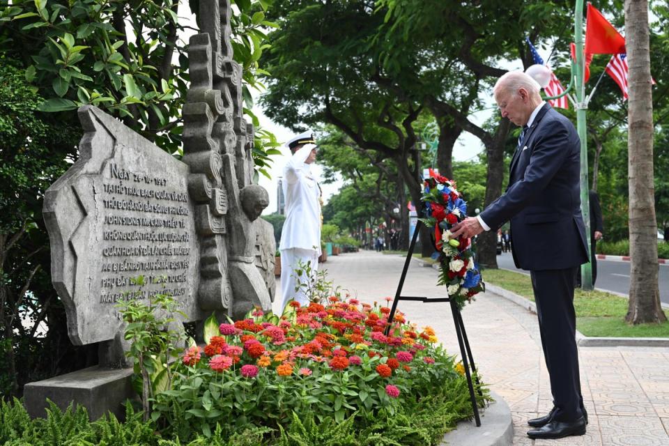 US President Joe Biden visits the John Sidney McCain III Memorial in Hanoi on September 11, 2023 (AFP via Getty Images)