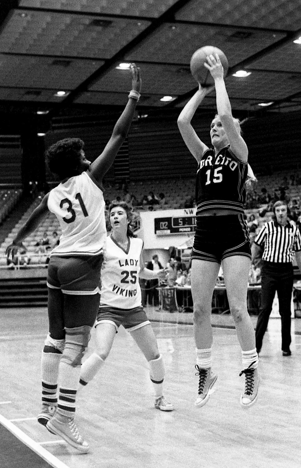 Loretto High standout Jennifer White (15), right, goes up for a shot against two Humboldt High defenders during Loretto 77-66 opening round victory in the TSSAA Class AA state tournament at Middle Tennessee State’s Murphy Center in Murfreesboro on March 7, 1978.