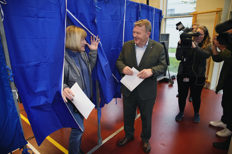 Head of the Moderates Party Lars Lokke Rasmussen and his wife Solrun Jakupsdottir Lokke Rasmussen cast their ballots, at Nyboder School in Copenhagen, Denmark, Tuesday, Nov. 1, 2022. Polling stations have opened across Denmark in elections expected to change the Scandinavian nation’s political landscape, with new parties hoping to enter parliament and others seeing their support dwindle. (Martin Sylvest/Ritzau Scanpix via AP)