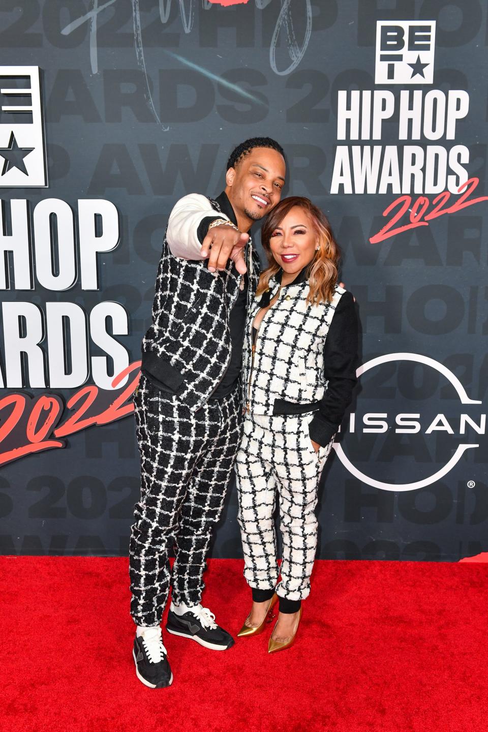 T.I. (L) and Tameka "Tiny" Harris (R) attend the 2022 BET Hip Hop Awards.