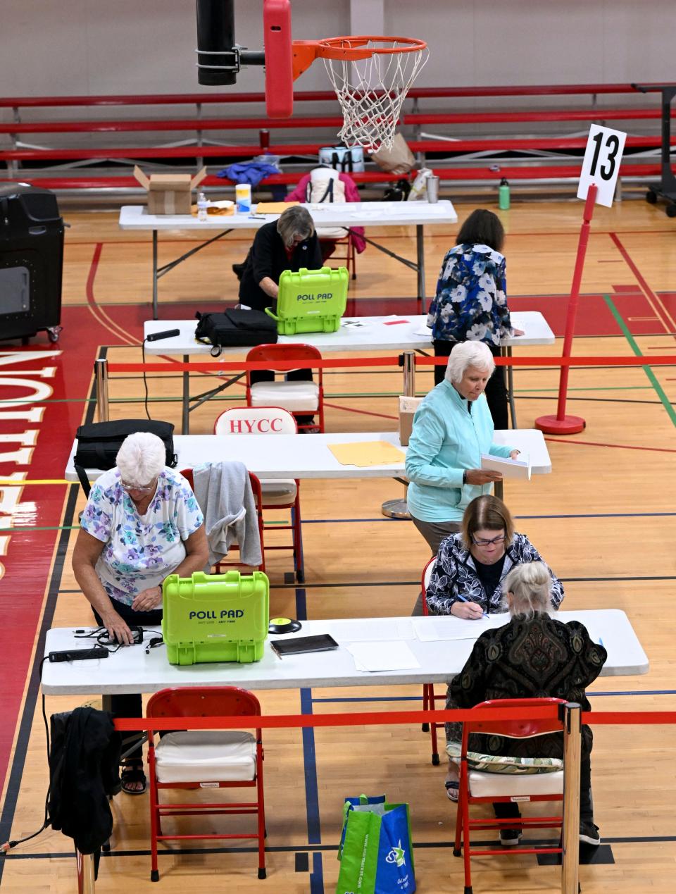 Election workers count ballots for Barnstable precincts 8, 9 and 13 early Wednesday at the Hyannis Youth and Community Center, after a malfunction in a Town Hall vault caused a four-hour delay in voting.