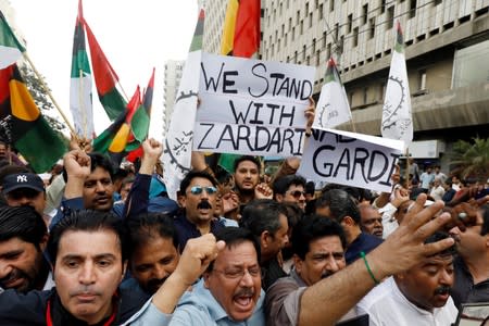 Supporters of political party Pakistan People's Party (PPP)carrying signs and flags chant slogans during a protest in Karachi