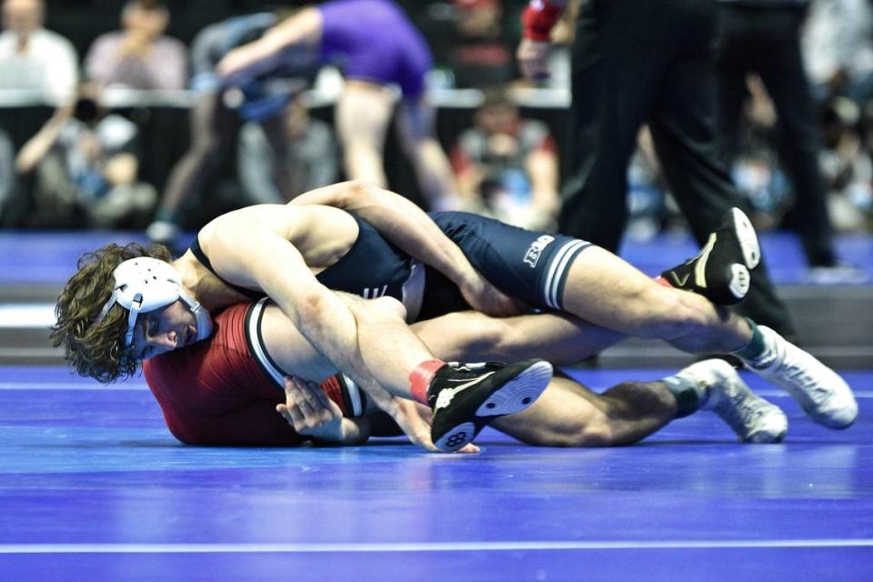 Penn State’s Levi Haines finishes off a takedown of Lock Haven’s Ashton Eyler in their 157-pound first round match of the NCAA Championships on Thursday, March 16, 2023 at the BOK Center in Tulsa, Okla. Haines beat Eyler, 10-3.