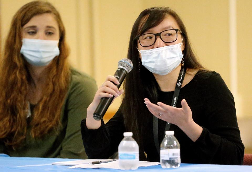 Lingling Liu, community health and equity diversity and inclusion coordinator for Memorial Health, speaks during the panel discussion Saturday at the One in a Million Resource Center. [Thomas J. Turney/The State Journal-Register]