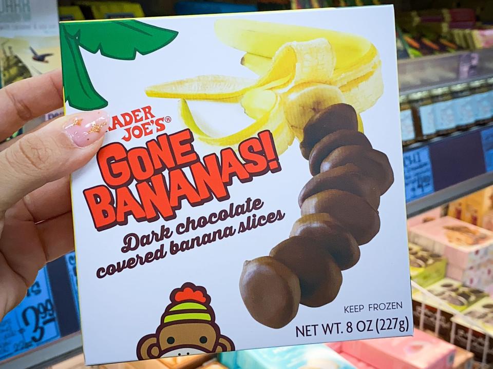 hand holding box of frozen banana slices at trader joes