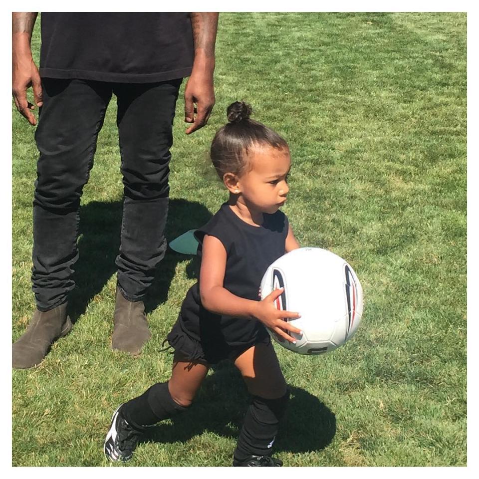 Break out the luxury minivans, Kim Kardashian is officially a soccer mom! The reality star posted adorable pics of 2-year-old daughter North West playing soccer on Friday, and it sounds like Kim is ready to embrace the role proudly. <strong>WATCH: North West Adorably Indulges in Sweet Treat, But Majorly Misses Her Mouth </strong> "Officially a soccer mom!" Kim wrote on one pic, adding the hashtag "#MyLittleGoalie" along with the soccer ball emoji. <strong>WATCH: North West Is the Most Chic Ballerina Ever </strong> North dressed for the part, ever-so-stylishly in all black, but also kept safe with shin guards, knee-high socks and appropriate footwear. "She's doing so good," Kim gushed on the last photo in the set. "I'm just so proud!" <strong>WATCH: Kim Kardashian Reveals Hopes For Herself and Daughter North West in 10 Years</strong>